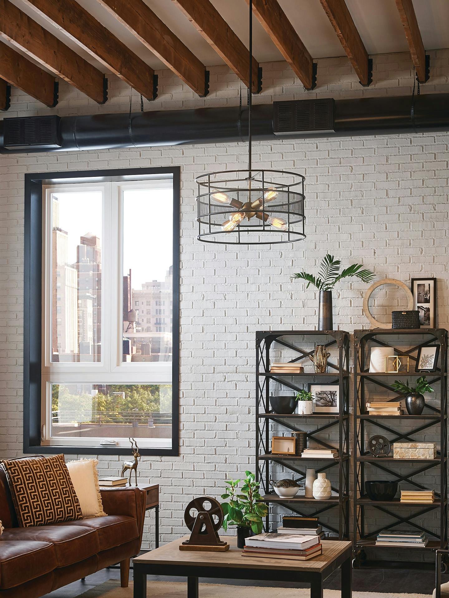 Piston pendant hanging over the couch in an industrial style apartment.