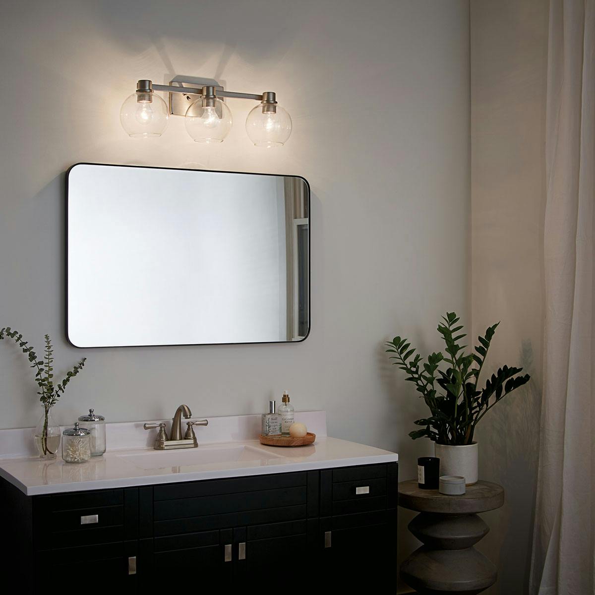 Night time Bathroom featuring Harmony vanity light 45894NI