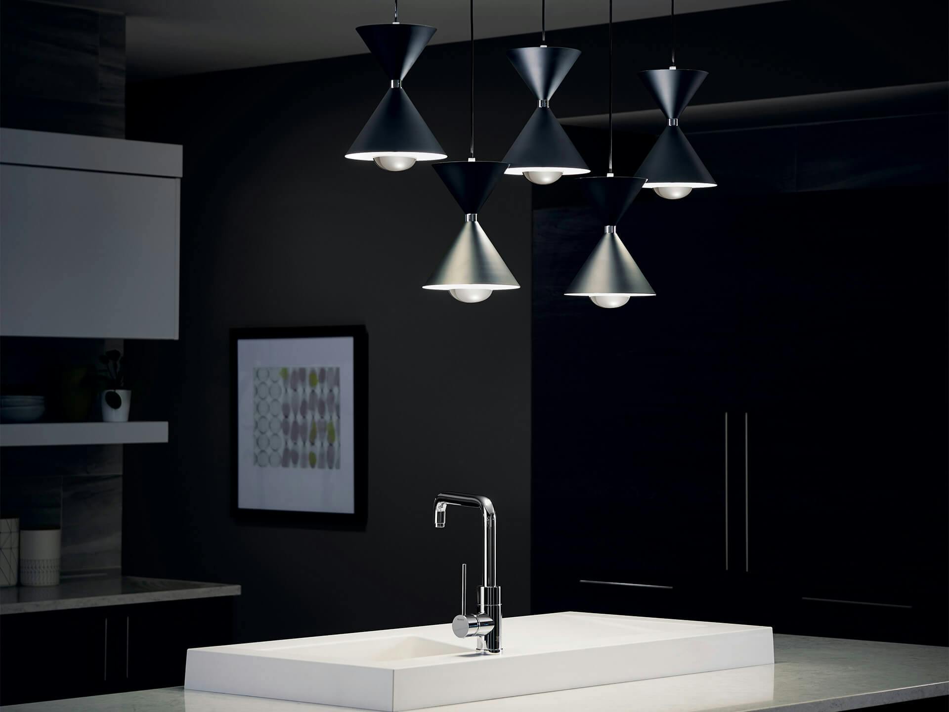 Kitchen at night featuring Jordan pendant lights above kitchen sink.