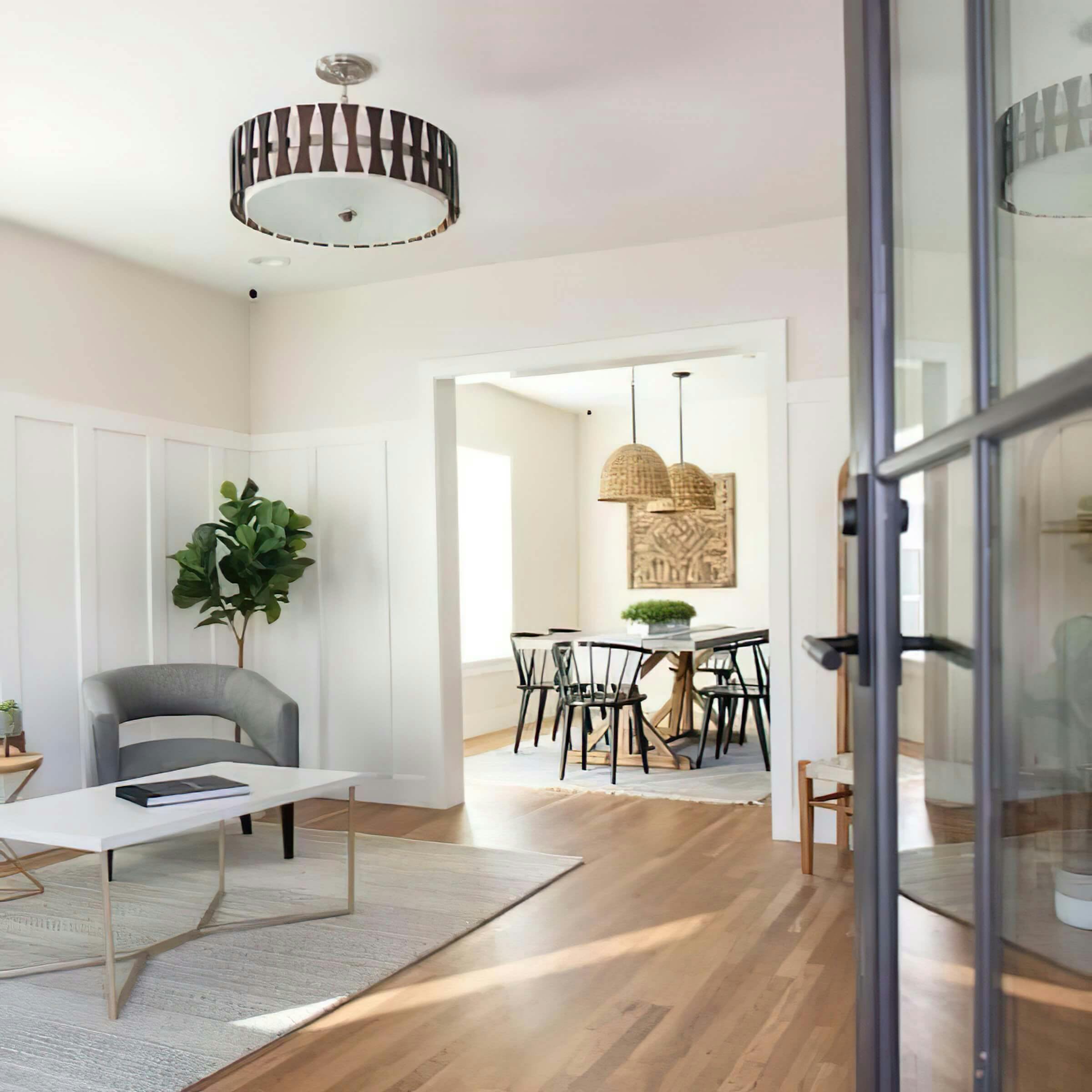 Sitting area lit by Kichler semi-flush fixture opening into Dining room