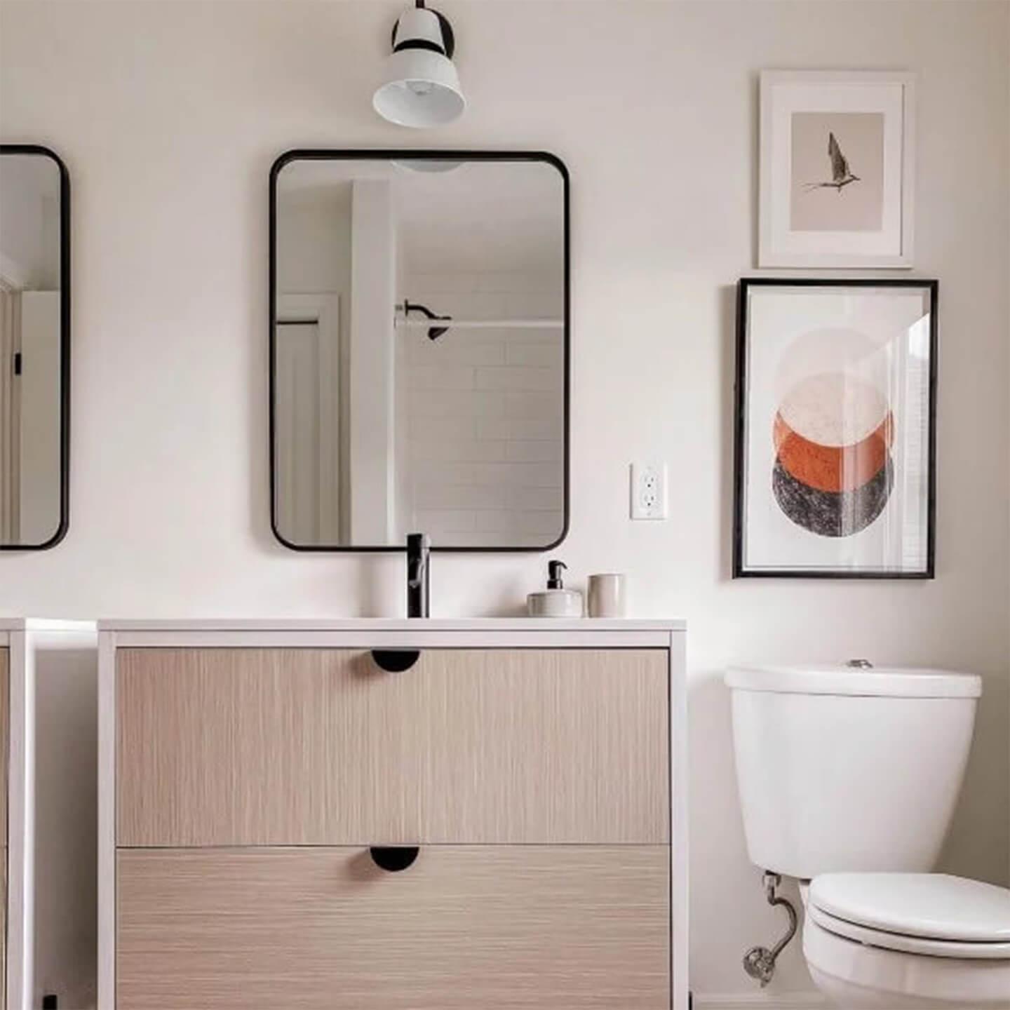 christinekissickhome instagram post of a vanity light above a bathroom sink