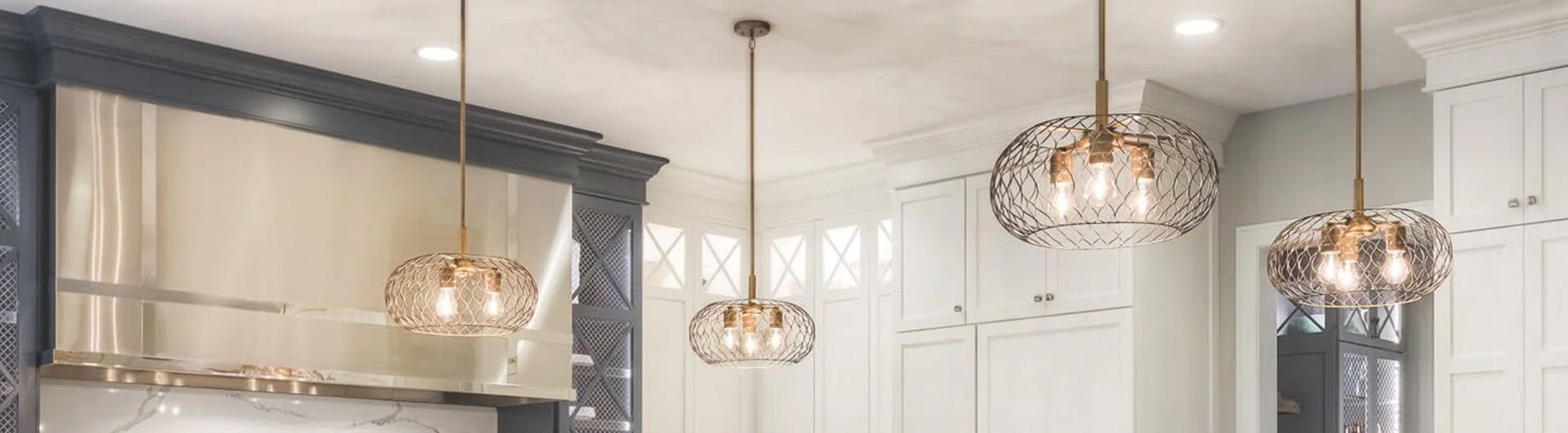 Modern farmhouse, focus on three lit Devin pendants