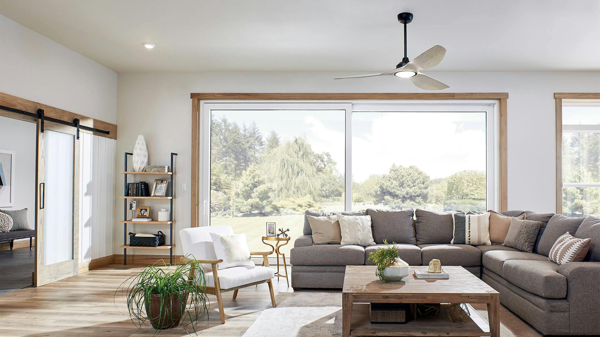 Living room during the day with a large window and features an Imari ceiling fan