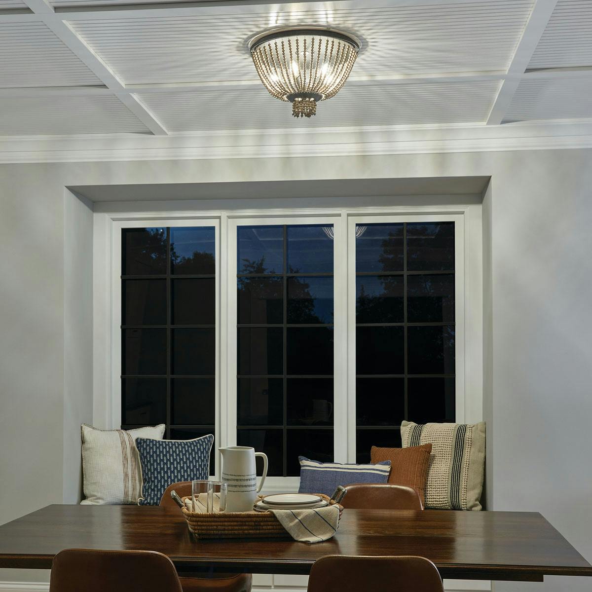 Night time dining room image featuring Brisbane flush mount light 43893DBK