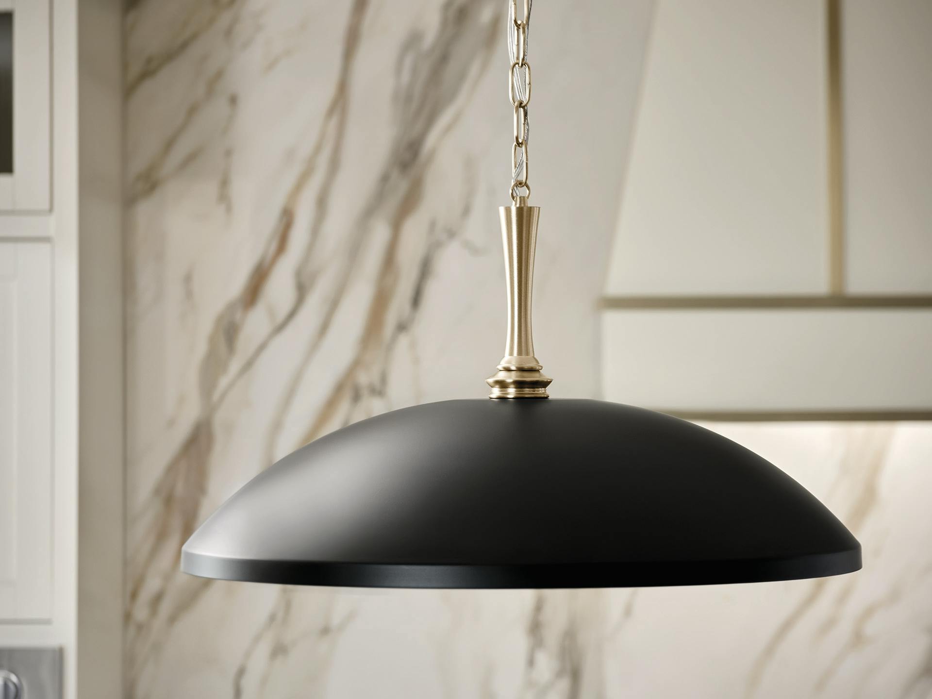 Delarosa pendant hanging over kitchen island