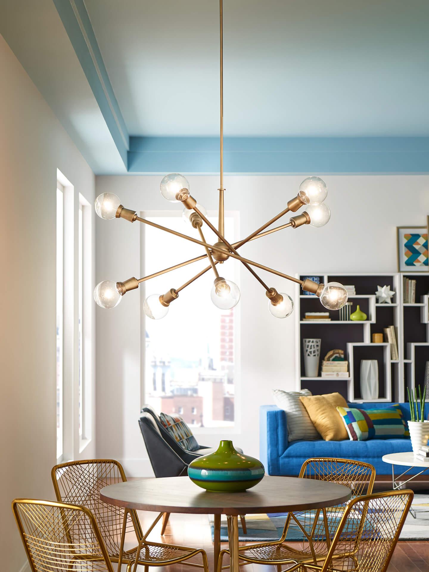 Colorful dining room with an Armstrong chandelier hanging