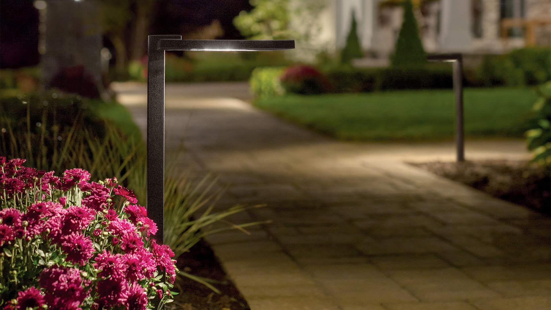 A landscape path lit up with Modern Farm house outdoor post lights