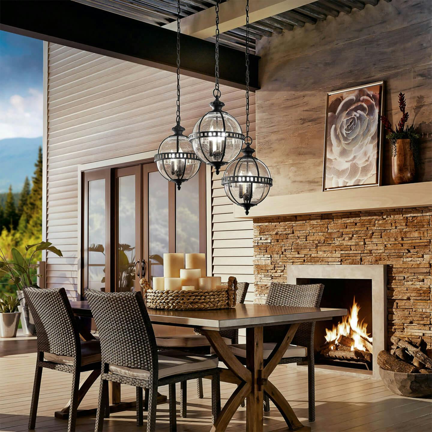 Exterior modern and elegant patio with Halleron pendants hanging above an outdoor table during the day 