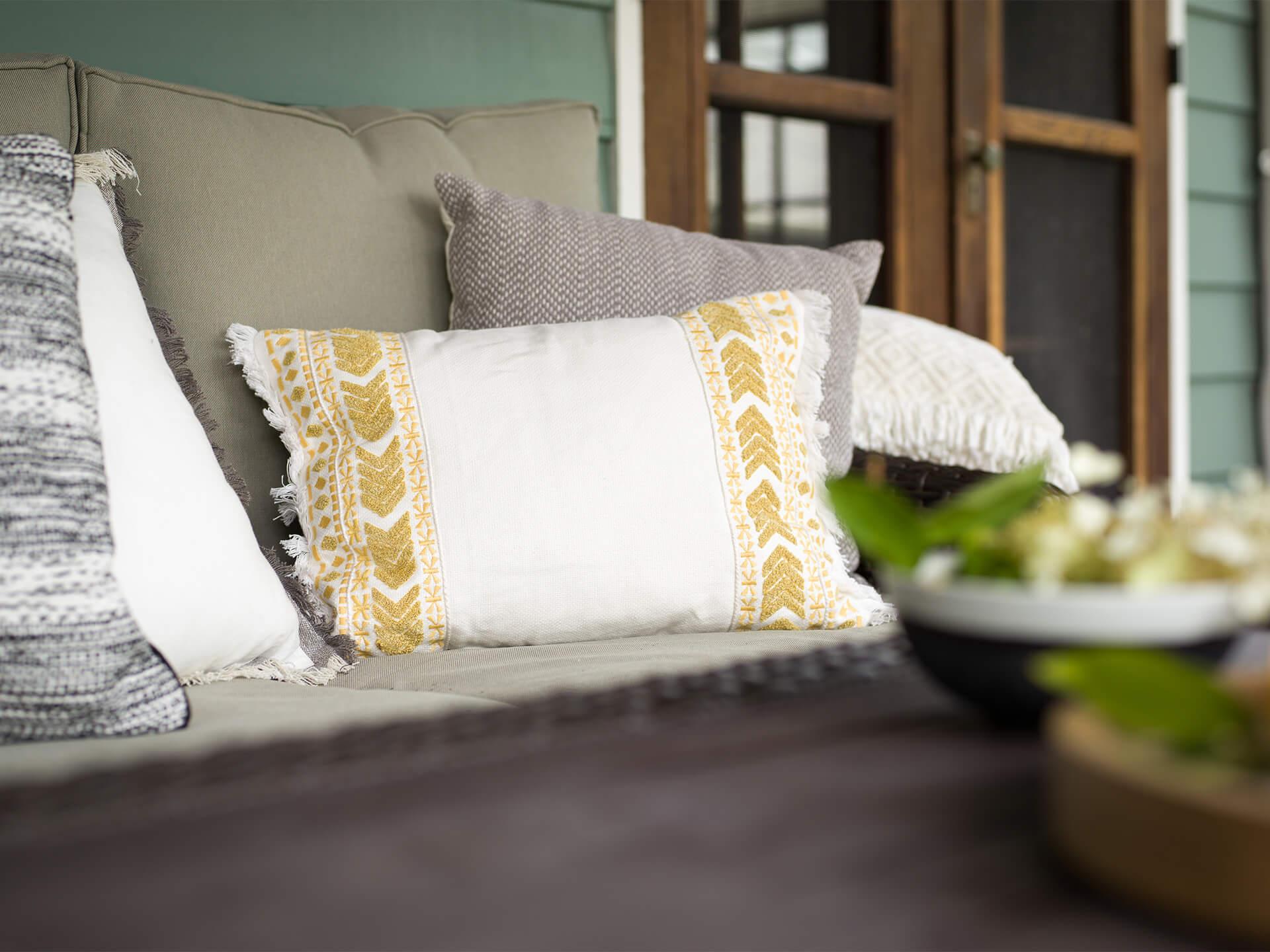 Lifestyle image of a porch with outdoor furniture in the daytime 