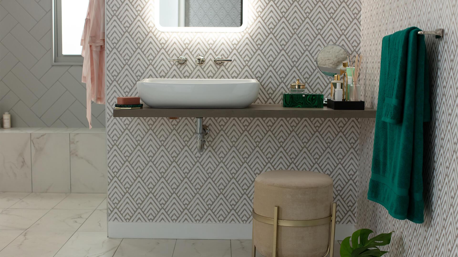 Detail of a mothers day home spa at a bathroom sink with a lit up signature mirror