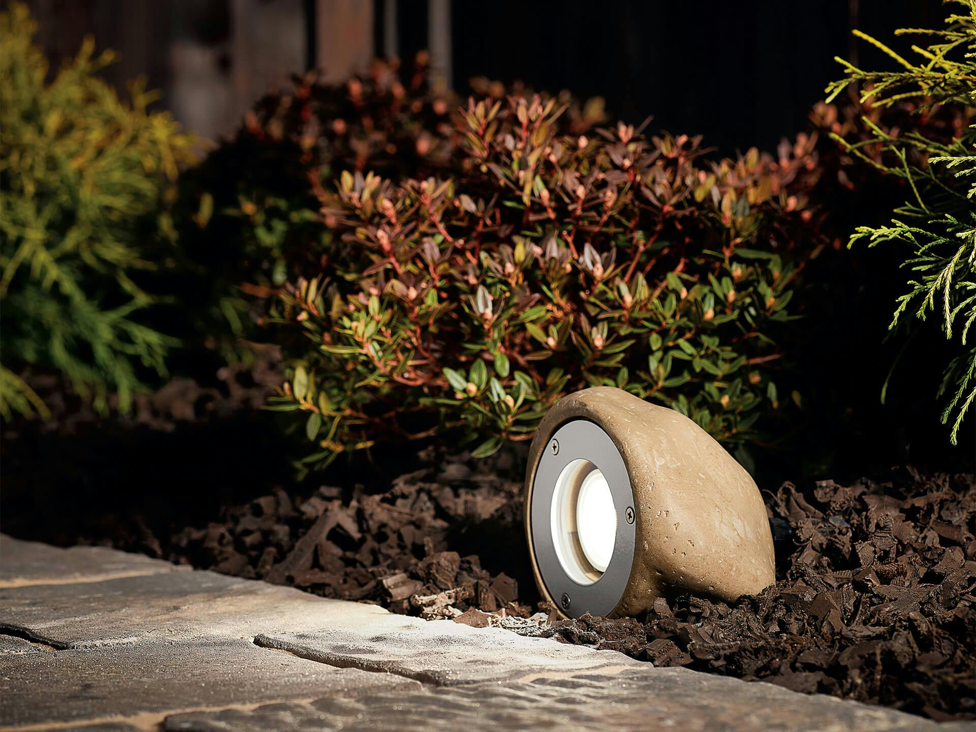 Landscape accent light hidden in rock to light pathway