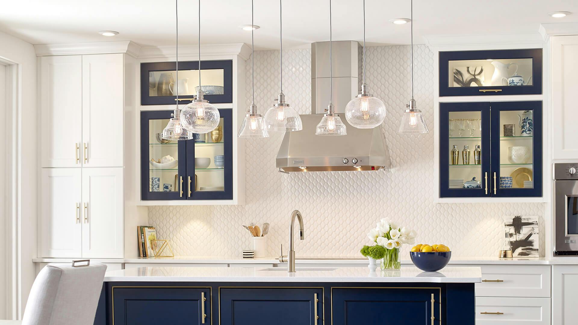 Kitchen lit up with Avery pendants above the kitchen island during the day 