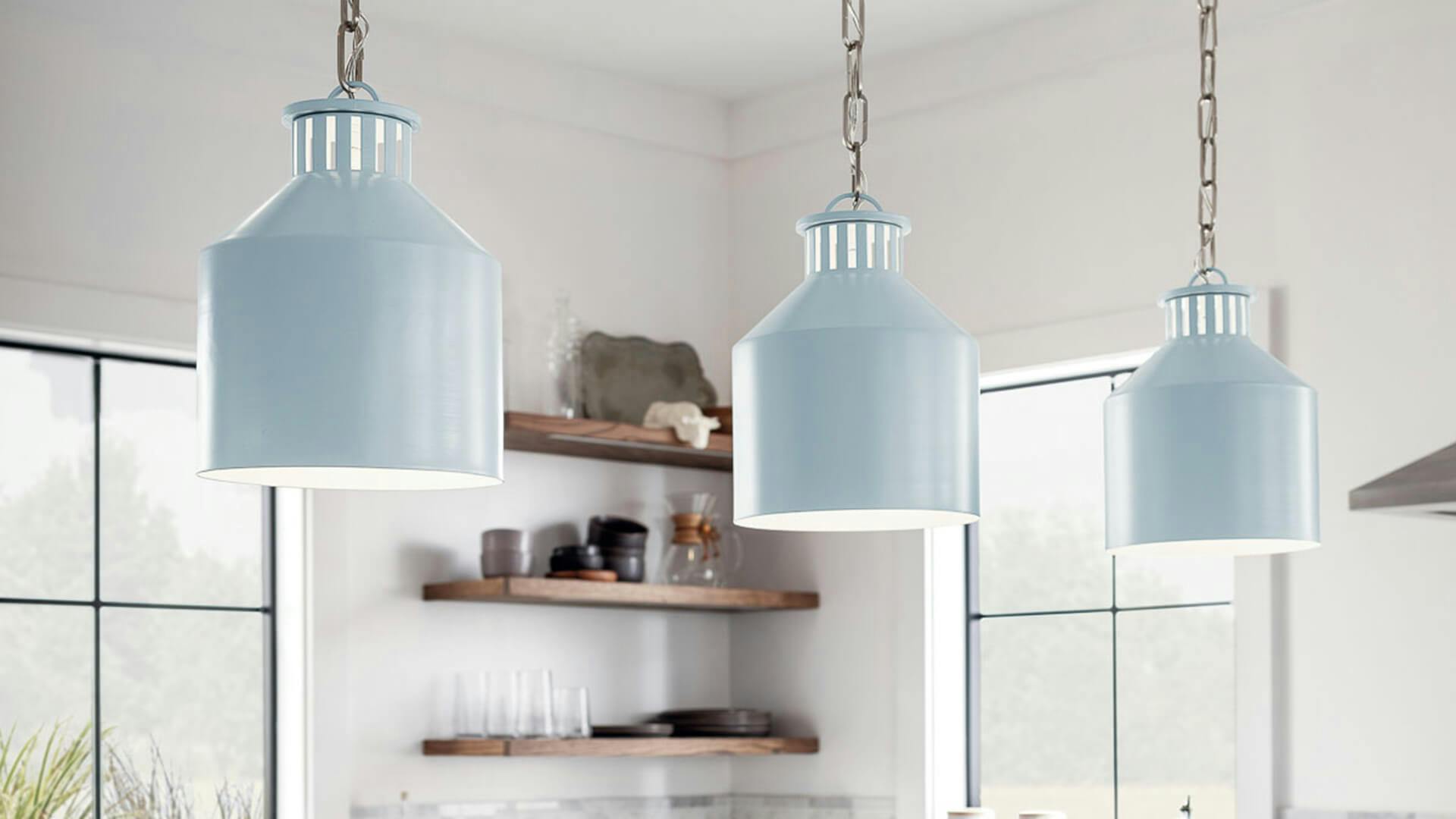 Close-up of three lit Montauk pendants in a kitchen setting