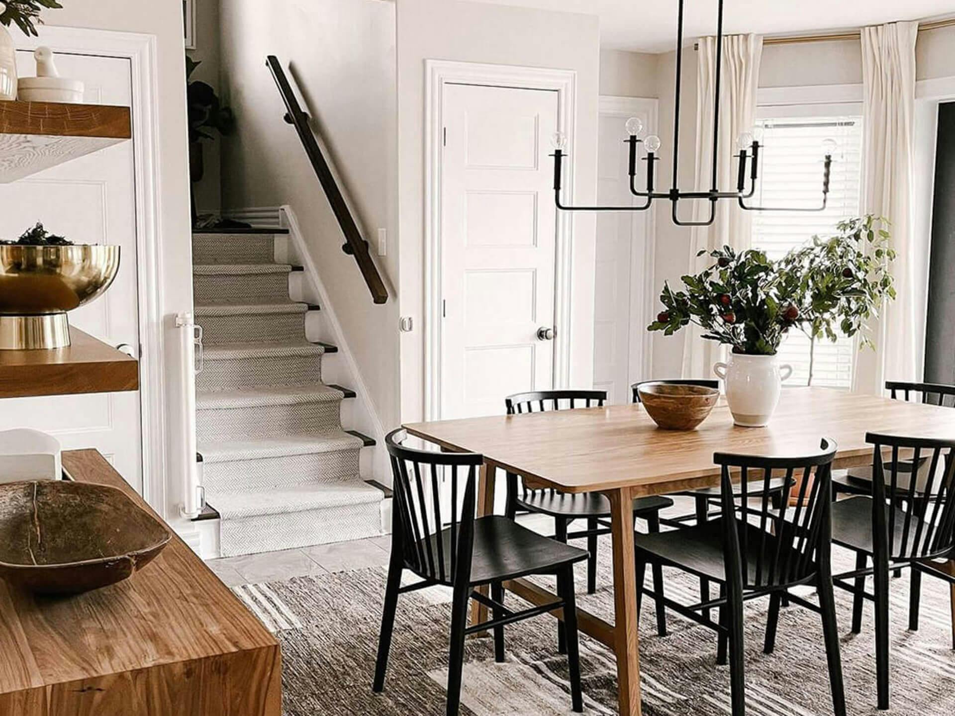 Farmhouse style dining room with modern touches and long dining table