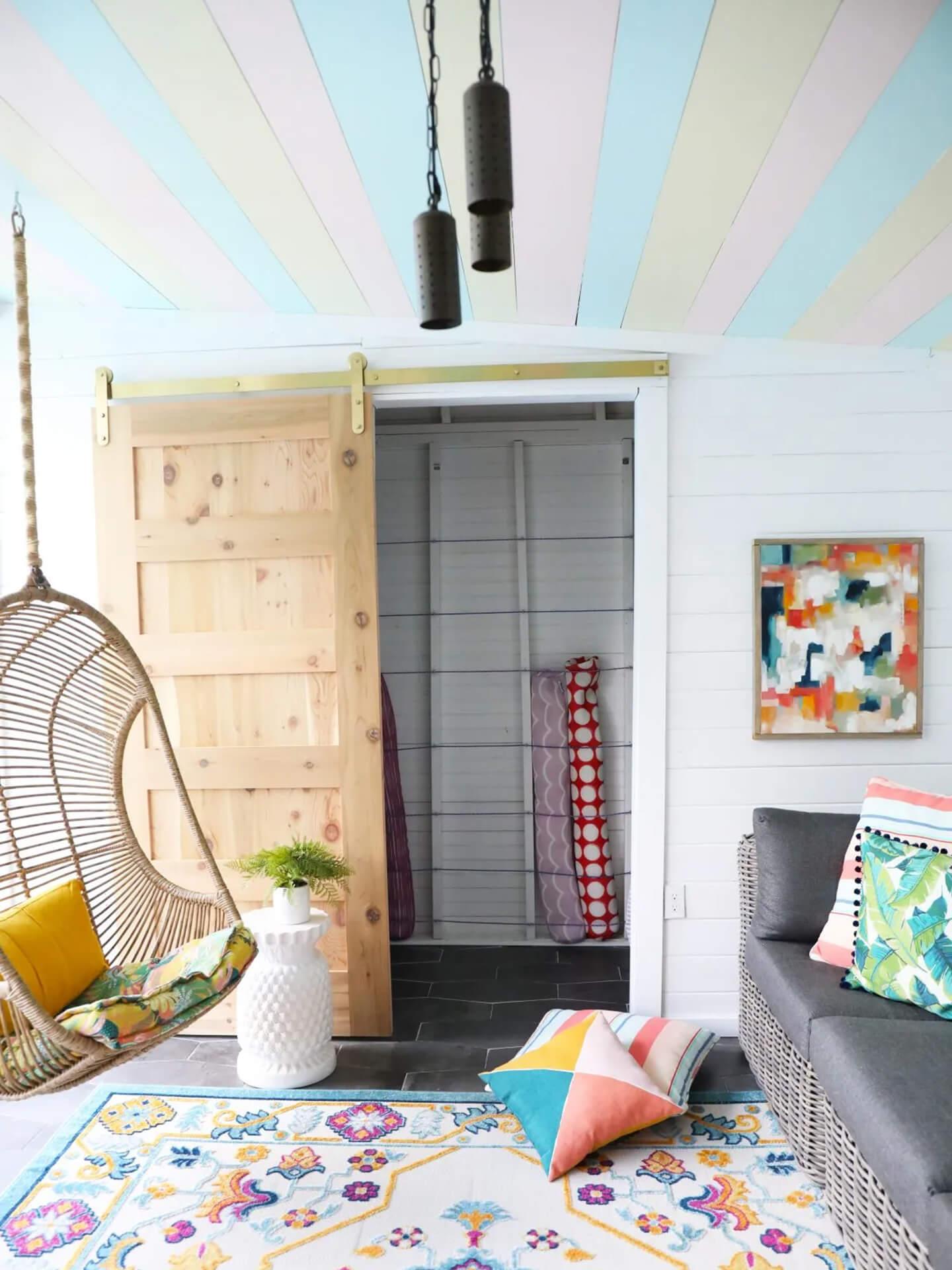 Colorful kids room, pastel rainbow painted on the ceiling