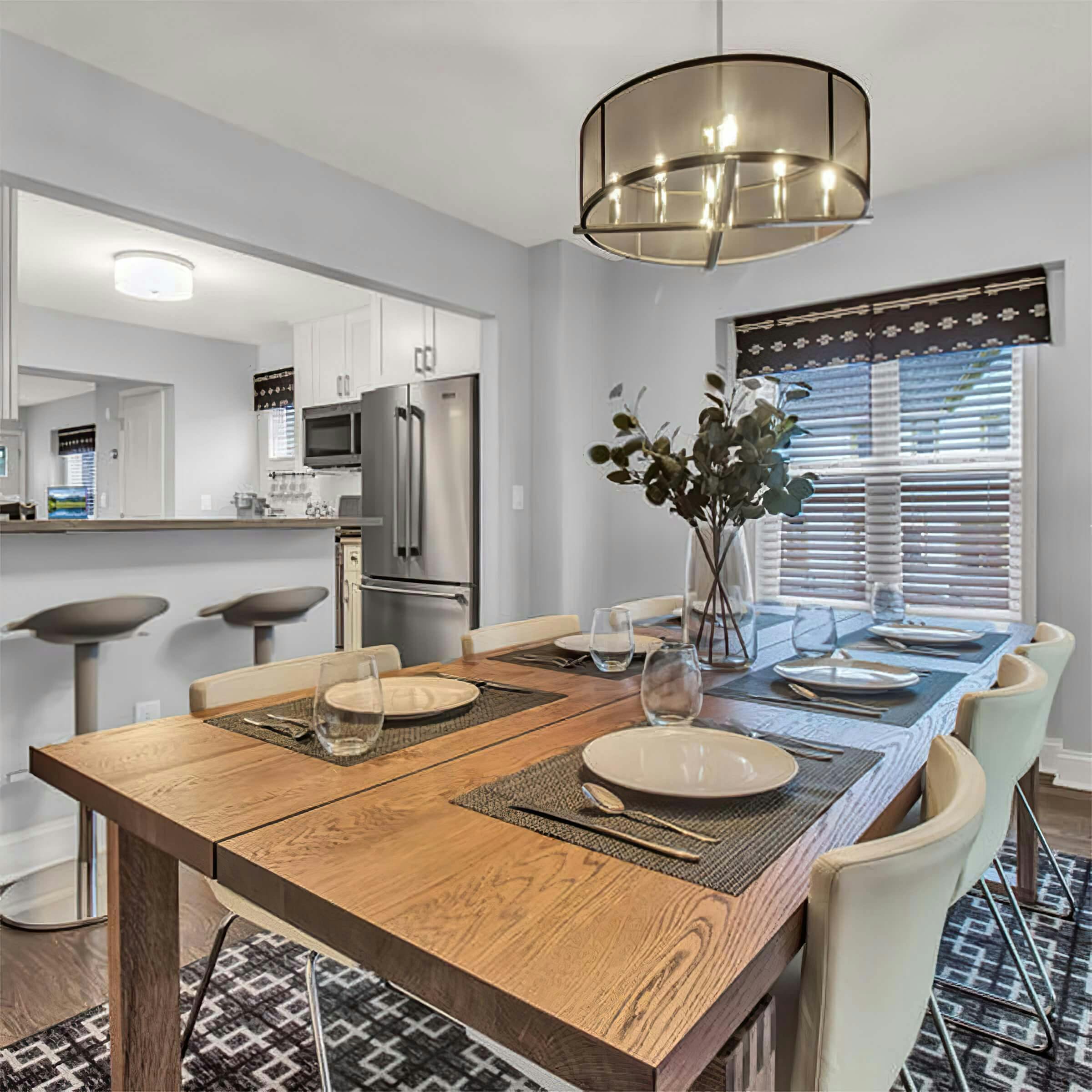 Dining room table and bar seating of an Airbnb