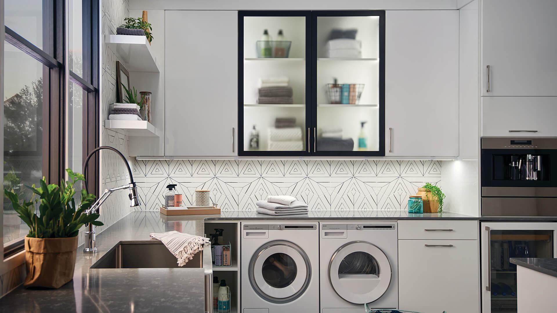 Laundry room with under the cabinet lights and interior cabinet lights.