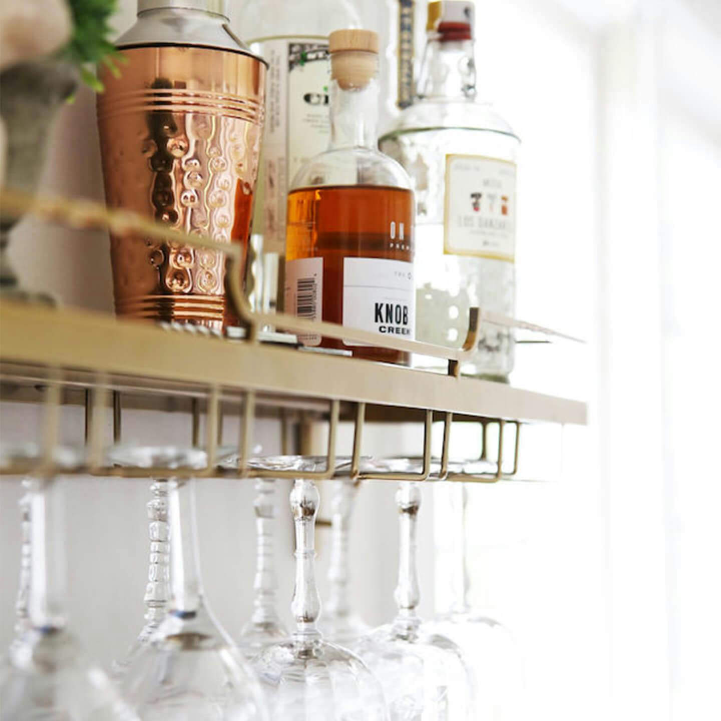 Bar shelf full of liquor bottles