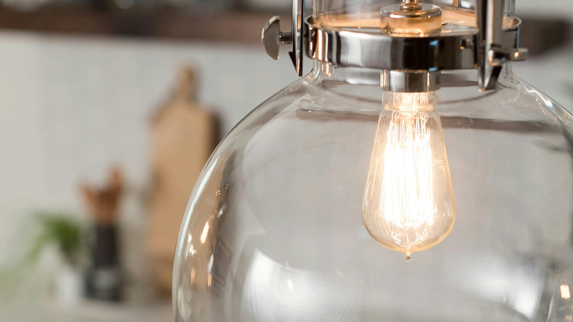 Close up of a Marilyn one-light pendant with a glowing bulb